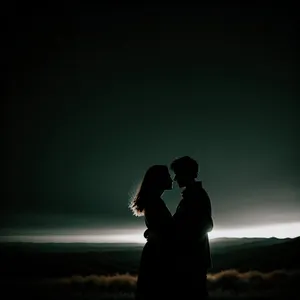 Romantic Sunset Silhouette of Newlywed Couple on Beach