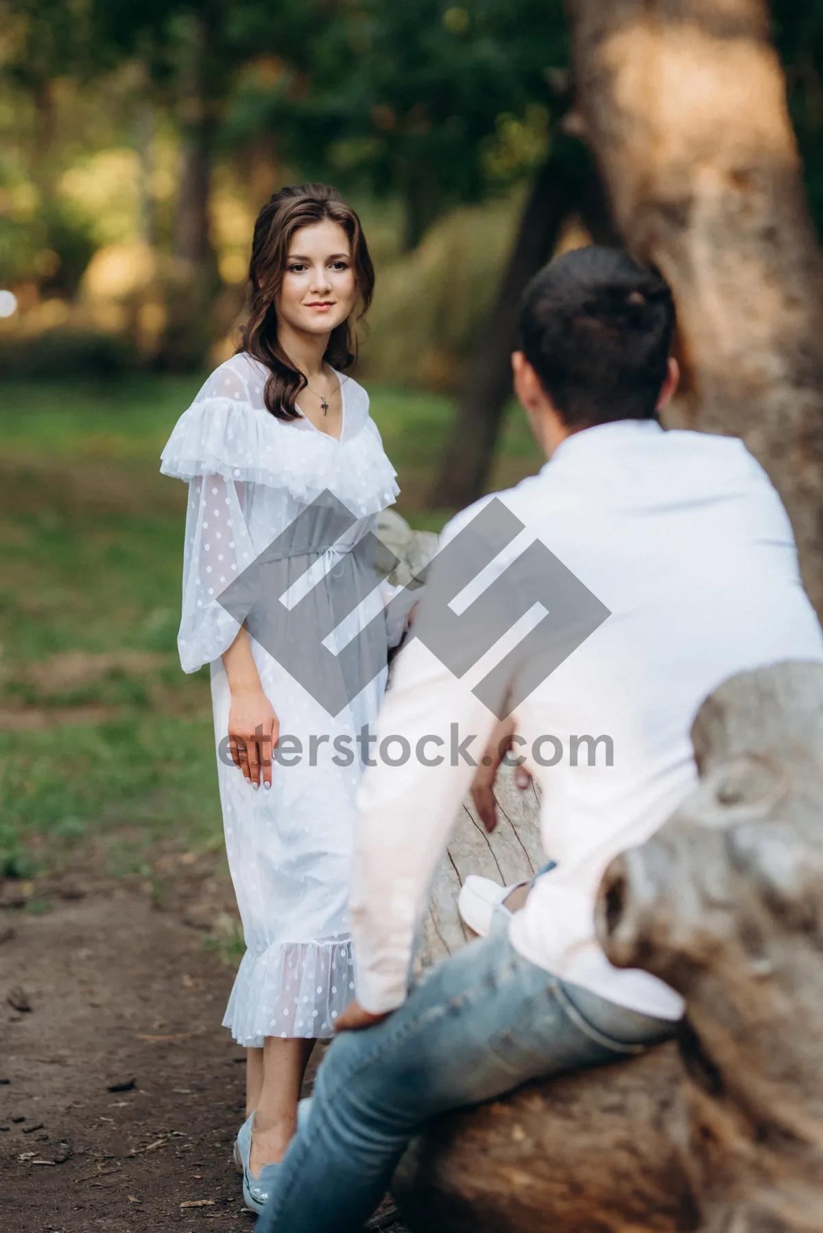 Picture of Happy newlywed couple in the park posing together joyfully