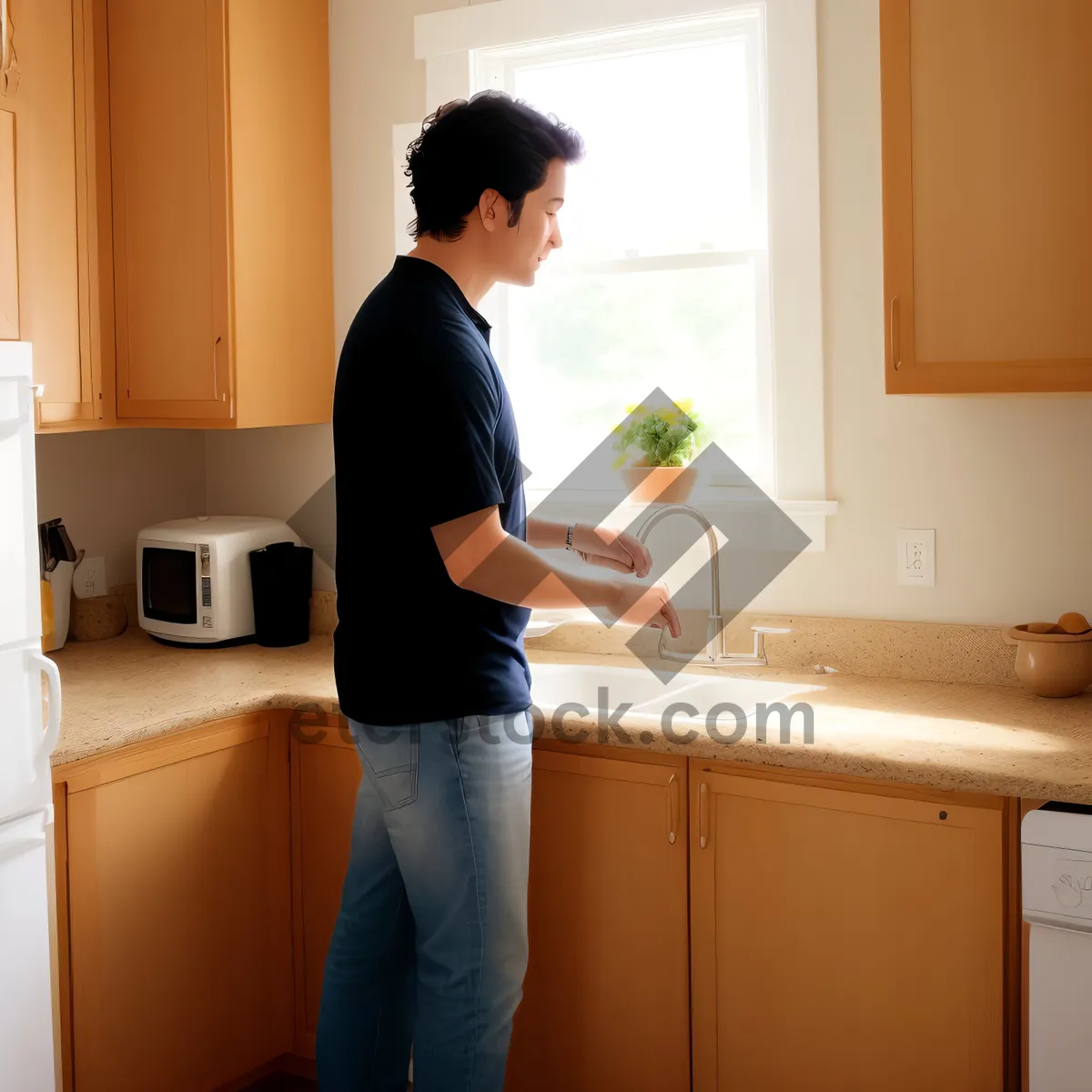 Picture of Happy man with microwave in modern kitchen.