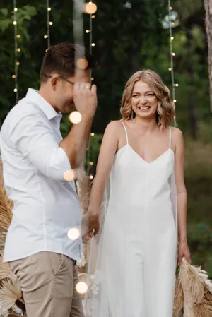 Happy Bride and Groom Celebrating Wedding Outdoors