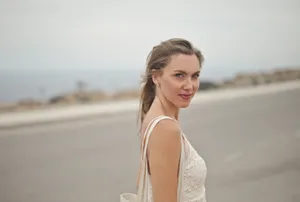 Smiling model enjoying summer at the beach