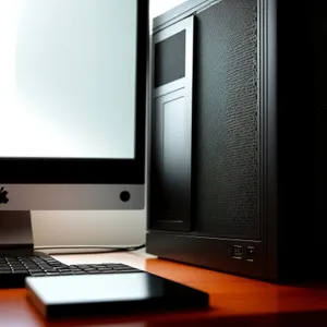 Modern desktop computer with keyboard and monitor.