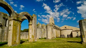 Medieval cathedral in historic city against blue sky.