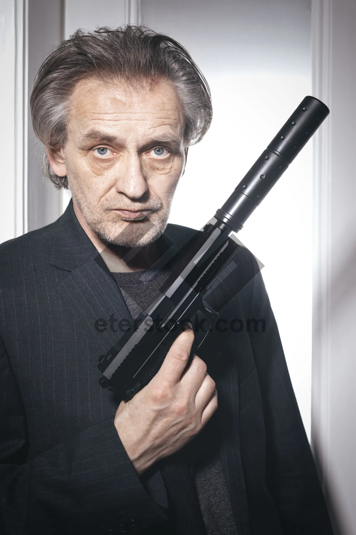 Picture of Handsome businessman with a firearm