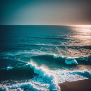 Serene Beachscape with Turquoise Waves and Golden Sand