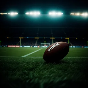Rugby Ball on Green Grass Field in Stadium