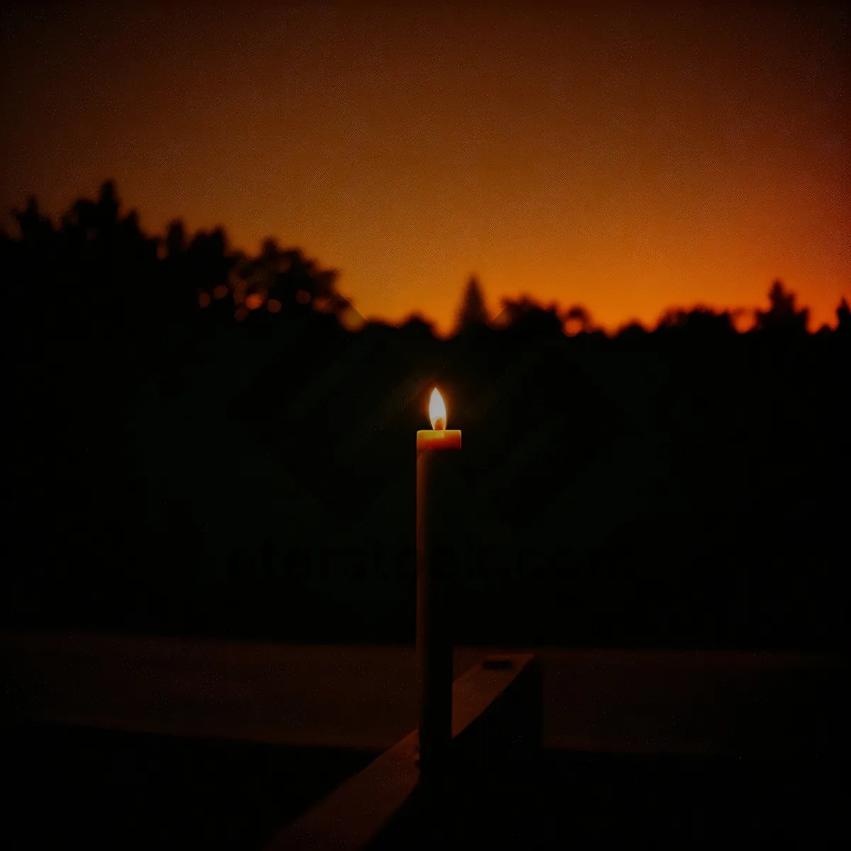 Picture of Twilight Glow: Silhouetted Torch against Darkening Sky