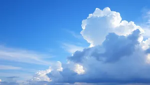 Summer Sky with Fluffy Clouds on a Sunny Day.