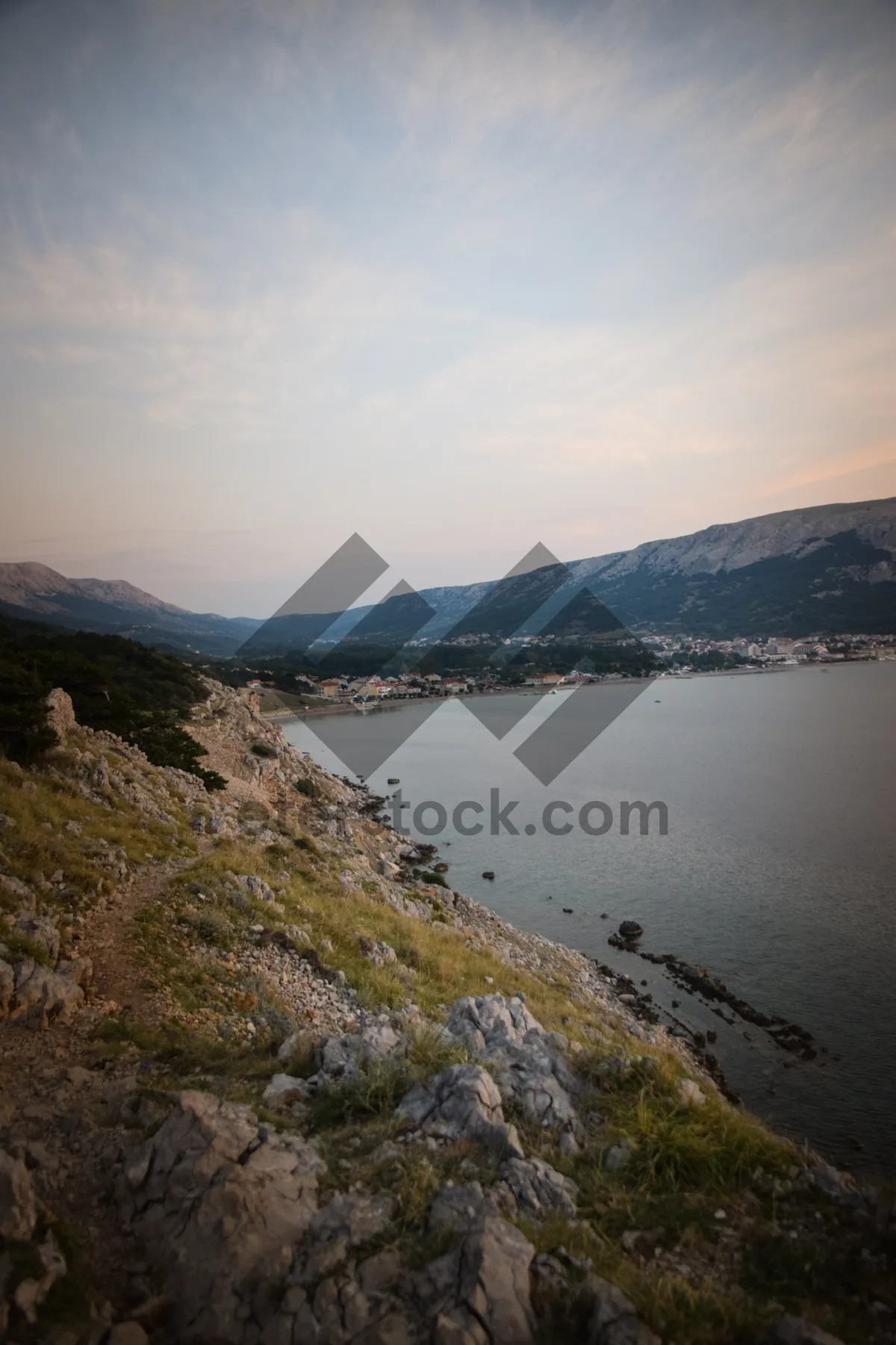 Picture of Mountain sunset over rocky cape with ocean view