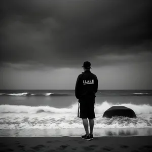 Silhouette of a Male Athlete by the Beach at Sunset