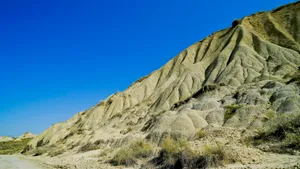 Mountain Range and Cliff Overlooking Valley in Summer