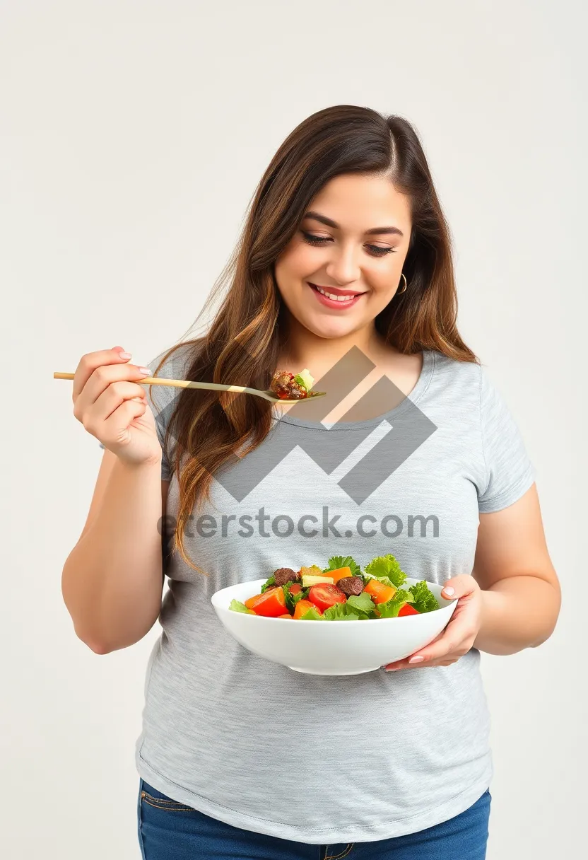 Picture of Happy businesswoman eating healthy food with a smile