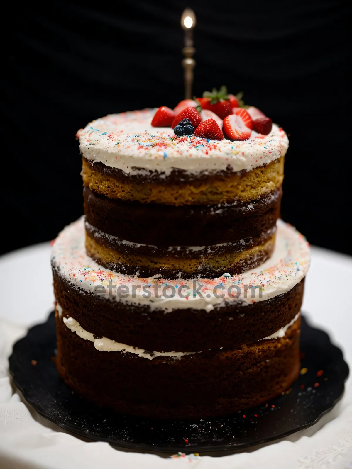 Picture of Delicious Berry Cream Cake with Sweet Chocolate Syrup.