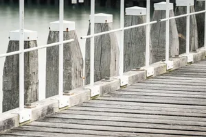 Old city house and picket fence by water