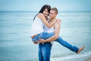 Happy Couple at Beach on Summer Vacation