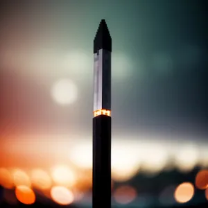 Pencil and Torch on Desk