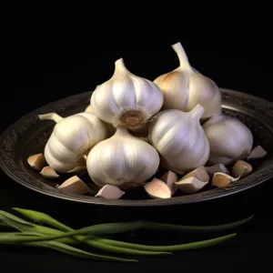 Fresh organic garlic and onion bulbs - essential ingredients for cooking.