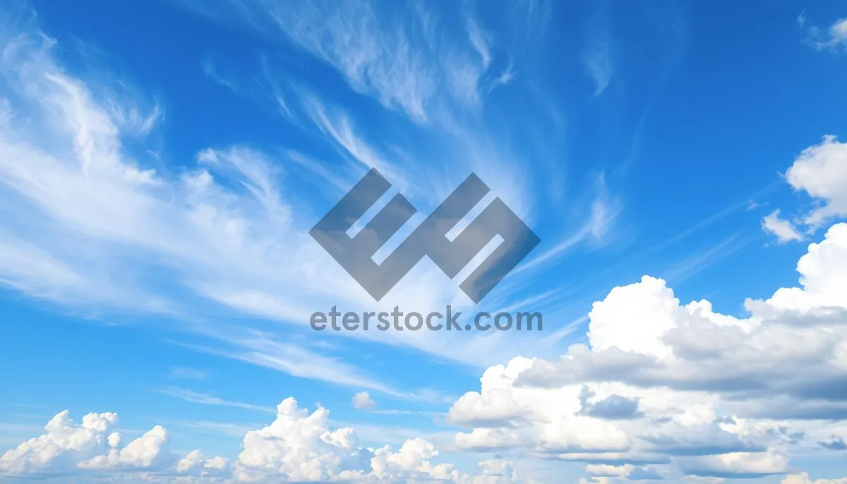 Picture of Bright Summer Sky with Fluffy Clouds and Sunshine