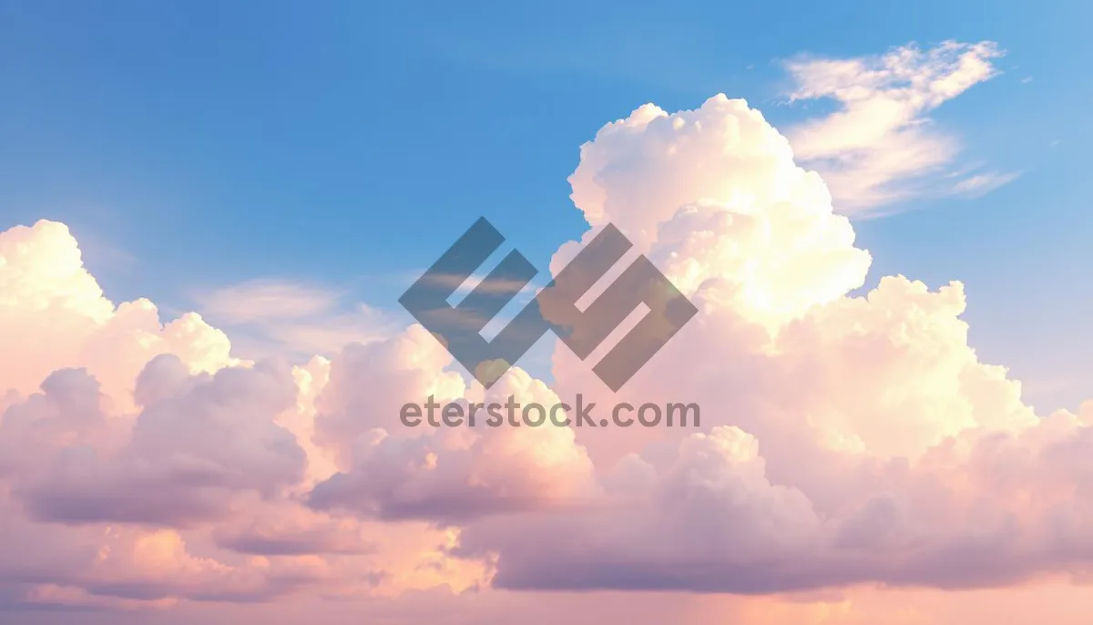 Picture of Bright Summer Sky with Fluffy Clouds and Sunshine.