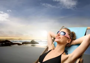 Attractive beach babe soaking up the sun