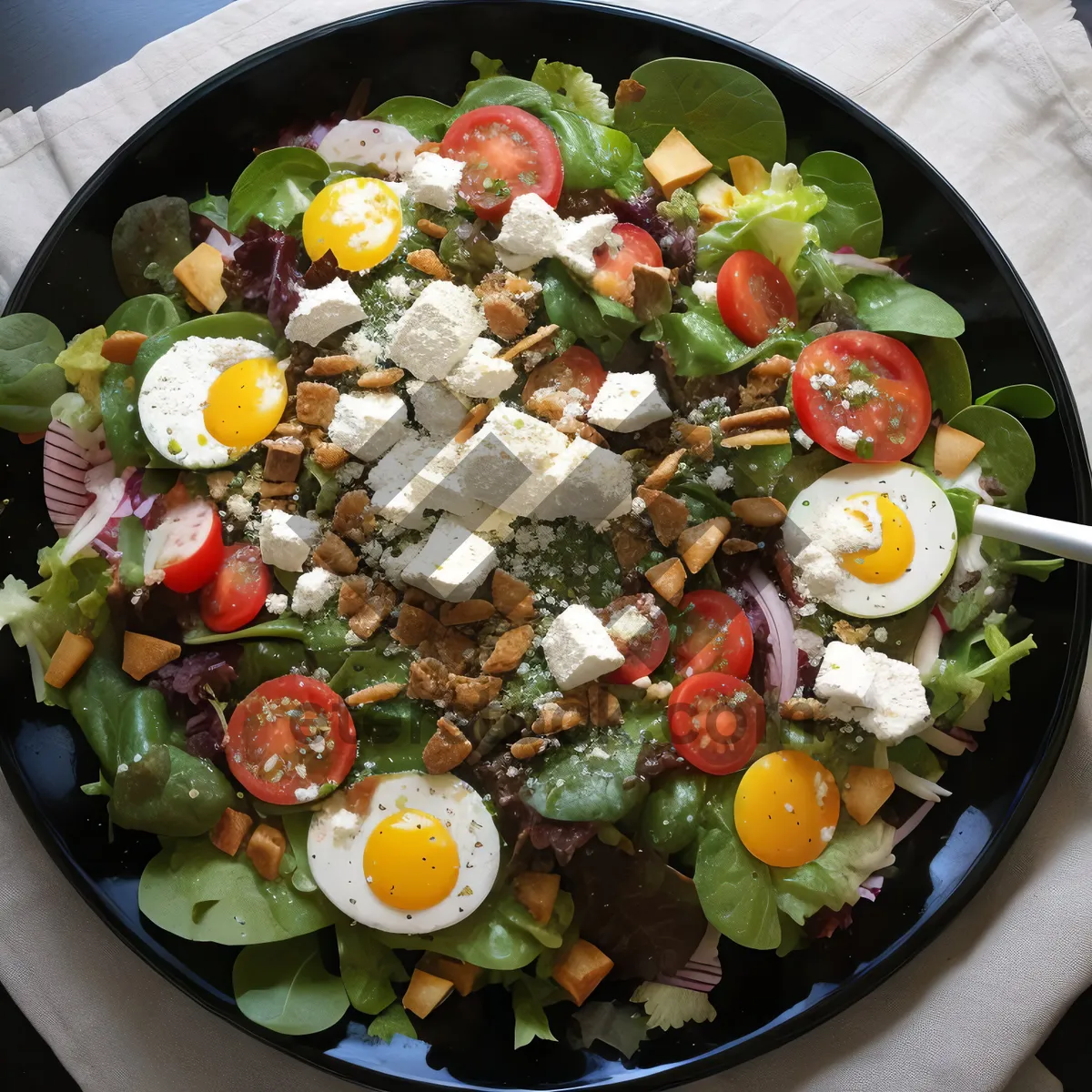 Picture of Delicious gourmet seafood salad with vegetables and sauce.