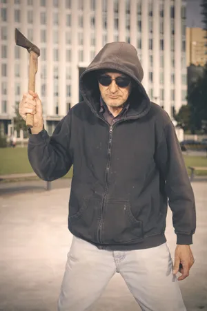 Man wearing ski mask and protective jacket portrait.