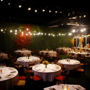 Restaurant interior with elegant table setting and wine glass