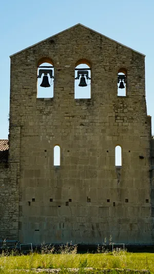 Medieval church tower in historic town square.