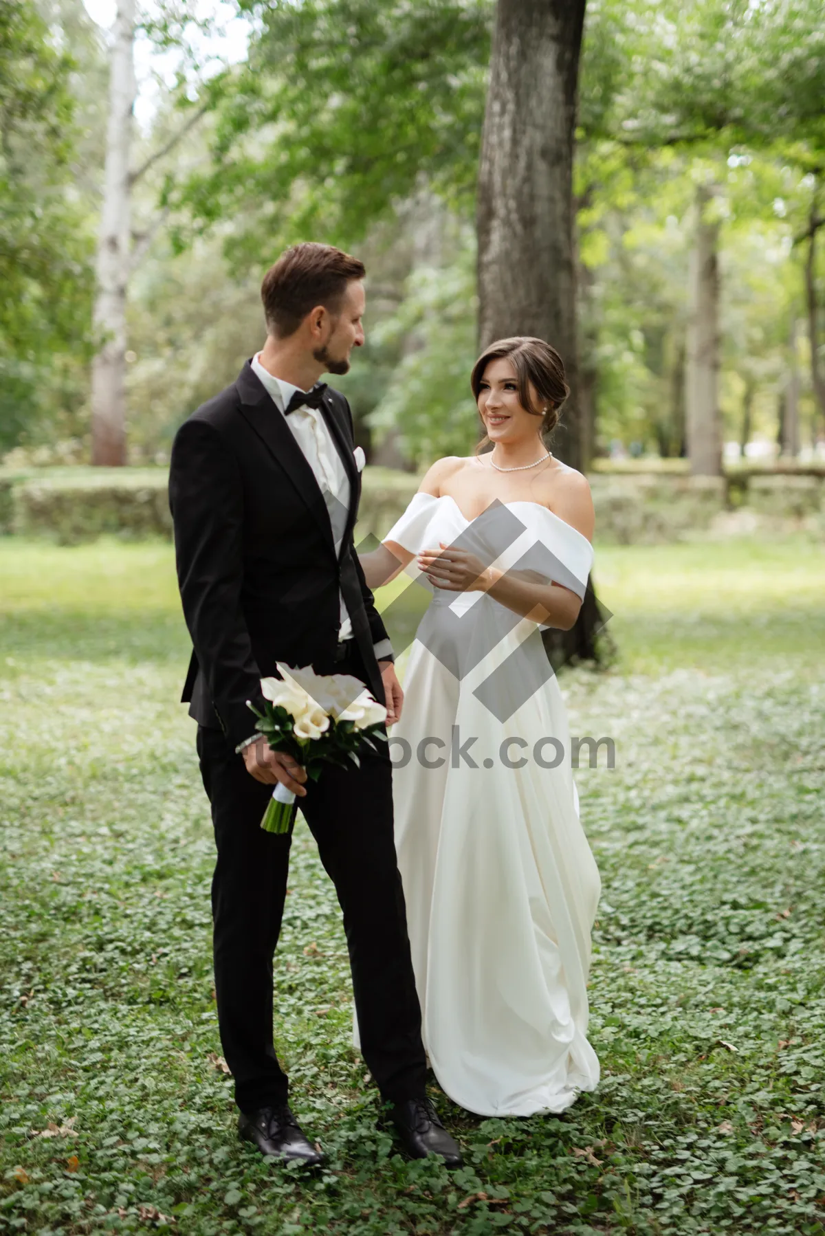 Picture of Happy couple celebrating wedding outdoors in the day