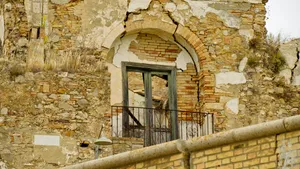 Medieval church with stone arch and ancient facade.