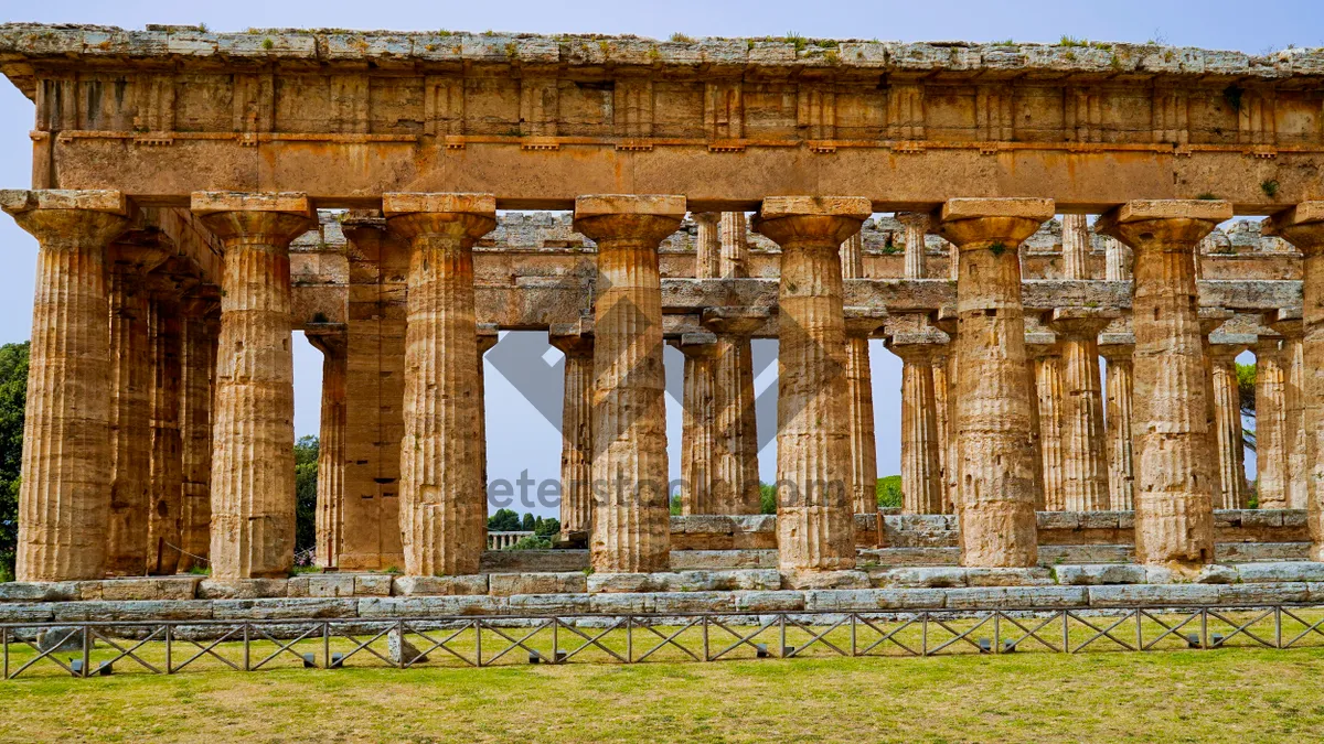 Picture of Ancient Roman Triumphal Arch Monument in Cityscape Sky