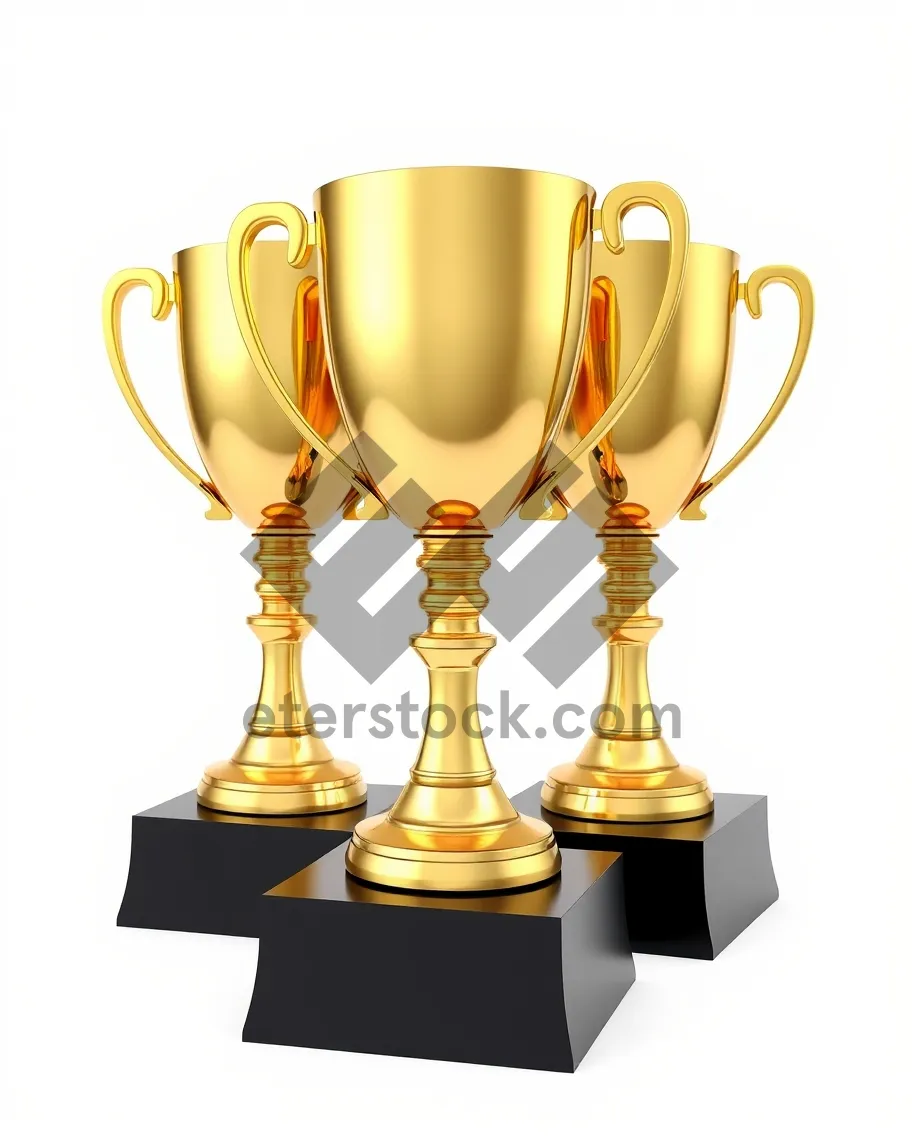 Picture of Gold and bronze wine glasses on glass table.