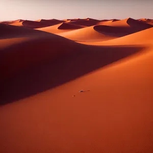 Serenity: A Sunset Soaring Over Desert Dunes