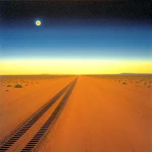 Majestic Sunset Silhouette over Desert Dunes