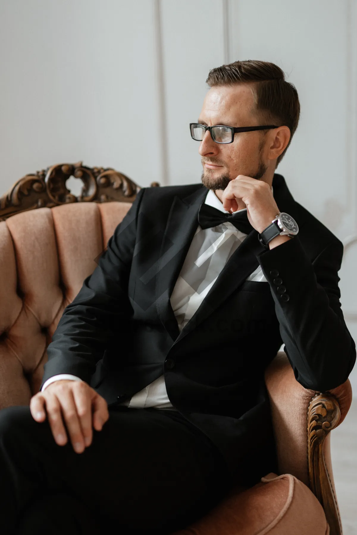 Picture of Happy businessman in suit smiling on cell phone call