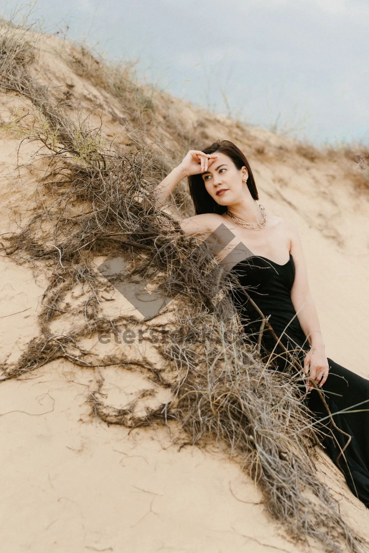 Picture of Pretty model posing in wheat field with cereal.