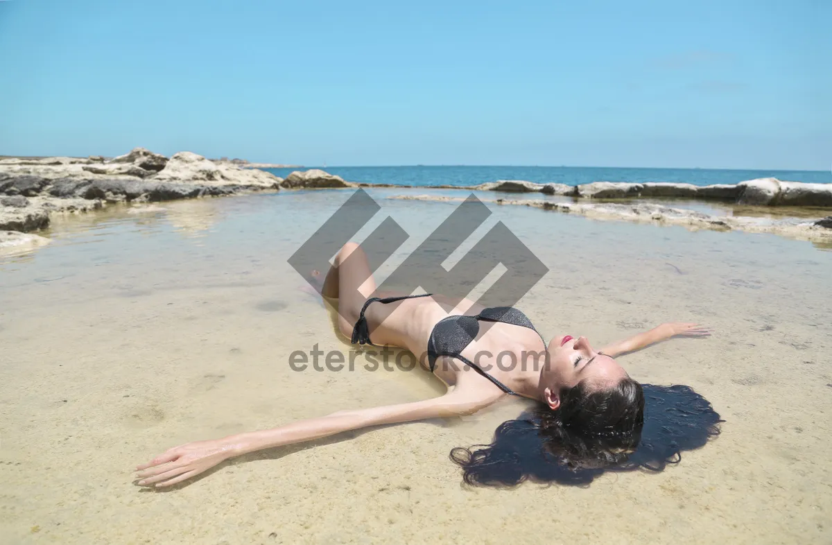 Picture of Happy model in bikini by the tropical beach