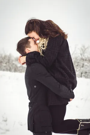 Happy man in winter fashion with scarf outdoors