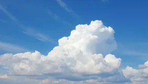 Bright summer sky with fluffy clouds