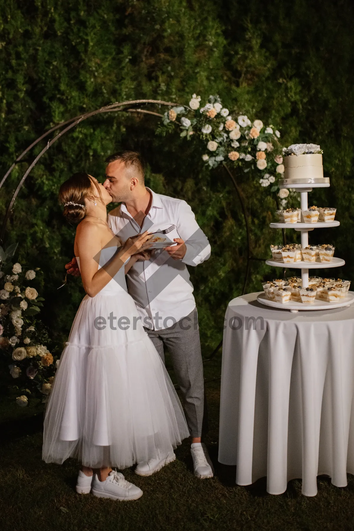 Picture of Happy couple celebrating wedding in park