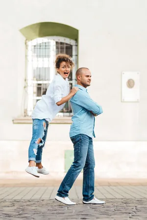 Happy family smiling together in casual clothing portrait.