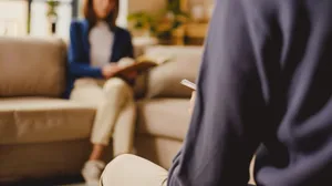 Happy Businessman Smiling in Corporate Office Setting