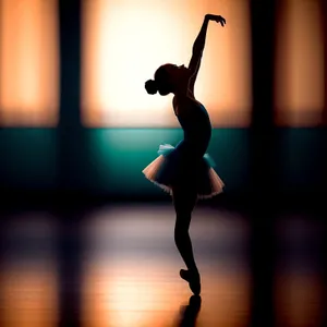 Elegant Dancer in Silhouette: Graceful Ballet Leap