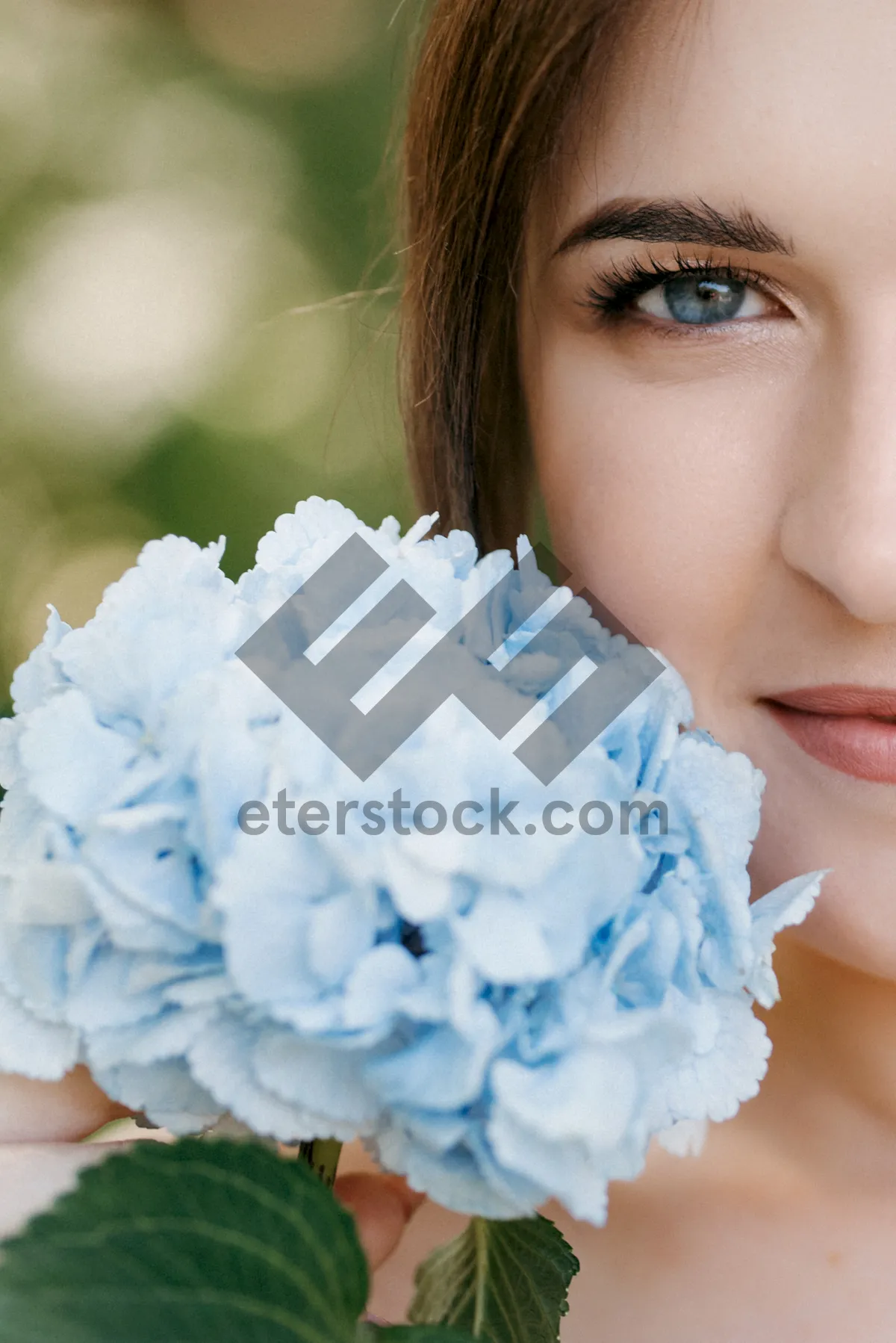 Picture of Attractive model with fresh makeup and flowers