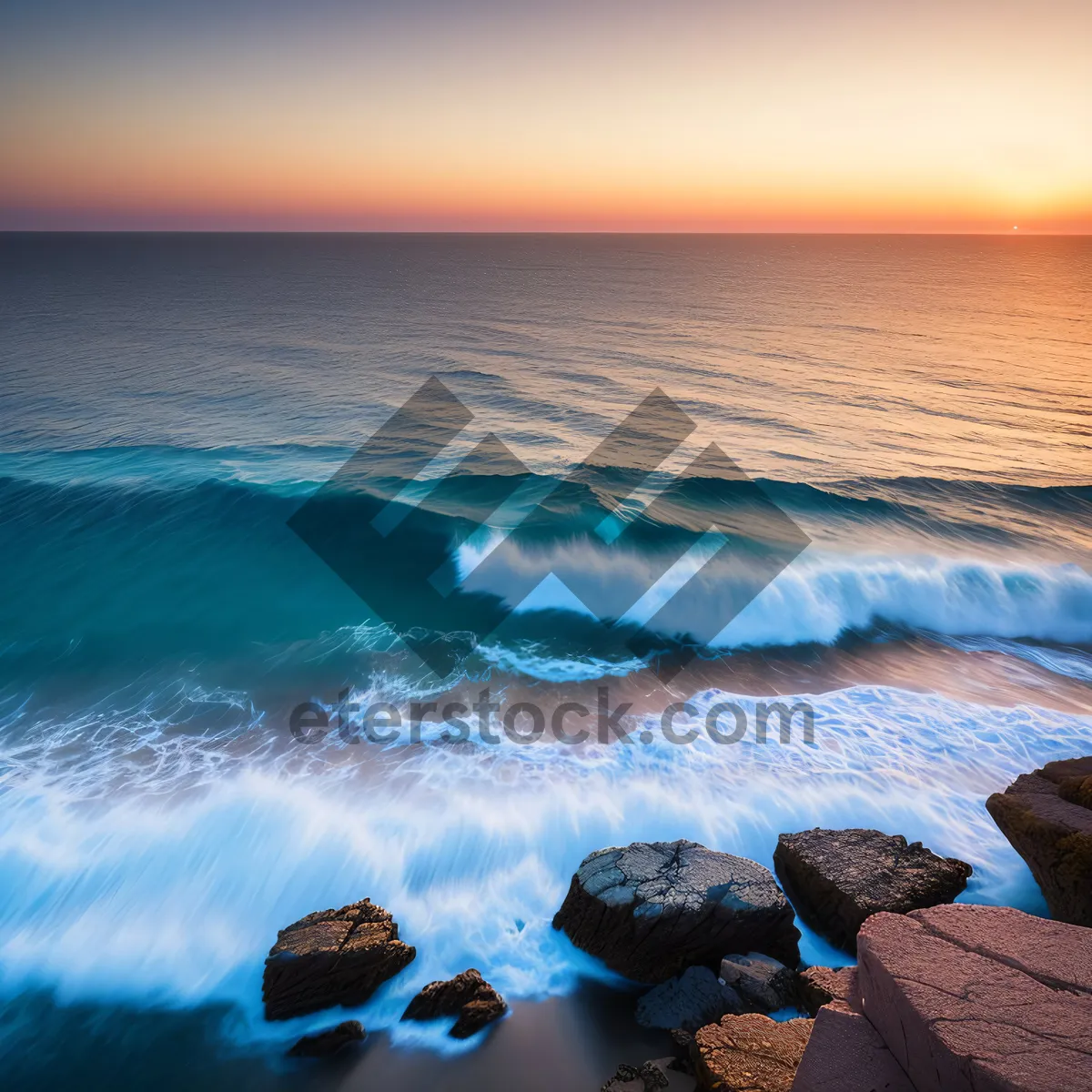 Picture of Tranquil Coastal Sunset: Waves crashing against sandy shore