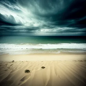 Serene Beachscape with Turquoise Waves and Clear Sky