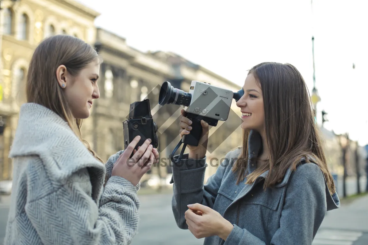 Picture of Professional male photographer with camera and lens