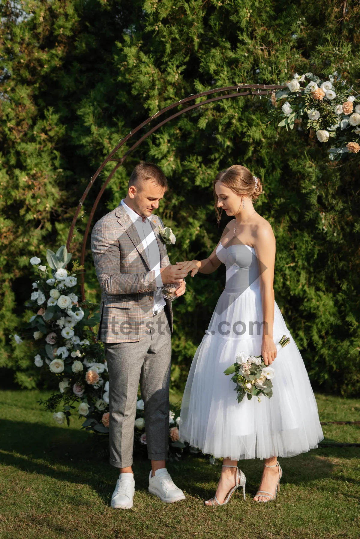 Picture of Happy groom and bride smiling on wedding day