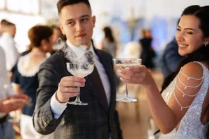 Happy couple enjoying drinks at restaurant