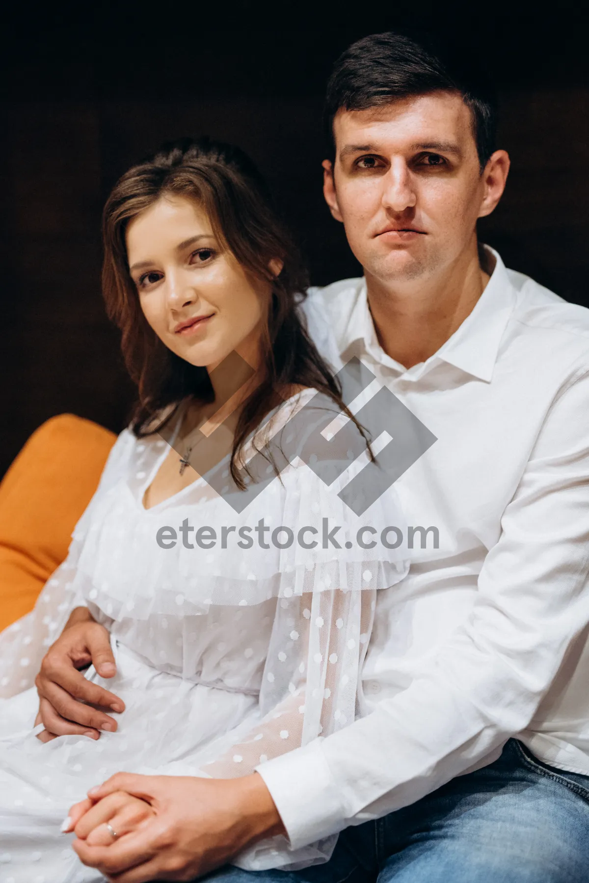 Picture of Happy couple smiling together, in 20s.